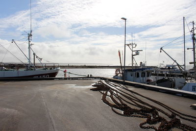 Boats moored at harbor