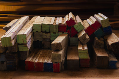 Close-up of multi colored umbrellas on wooden table