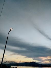 Low angle view of street light against sky