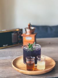 Close-up of drinks on wooden table