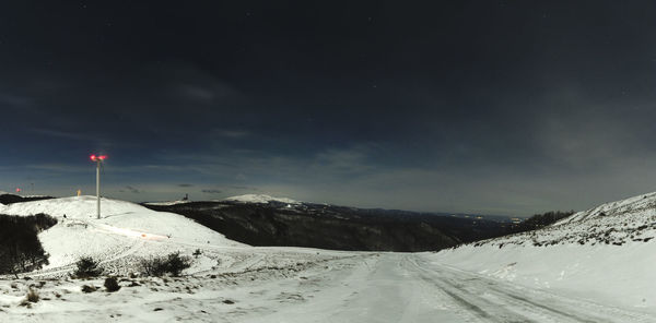 Scenic view of snow covered mountain against sky