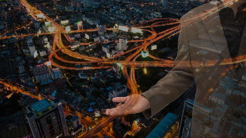 Digital composite image of businessman with cityscape