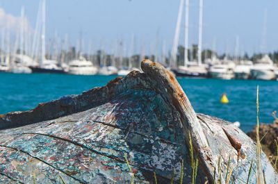 Close-up of fishing boat moored at harbor