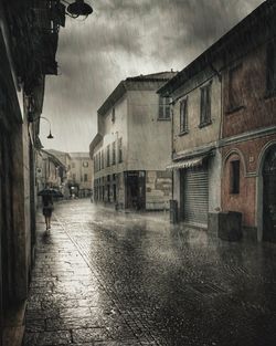 Buildings in city against sky