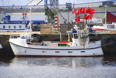 Boats moored at harbor