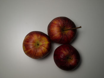 High angle view of apples on white background