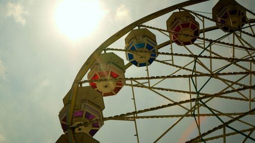 Low angle view of ferris wheel against sky