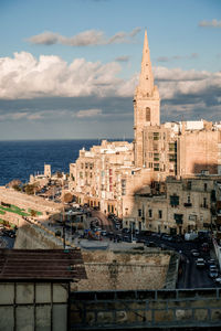 View of buildings in city against sky