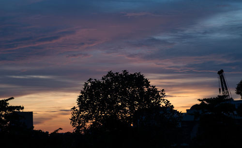 Silhouette of trees against sky at sunset