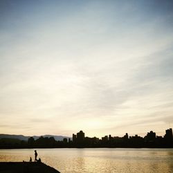 Silhouette of city at sunset