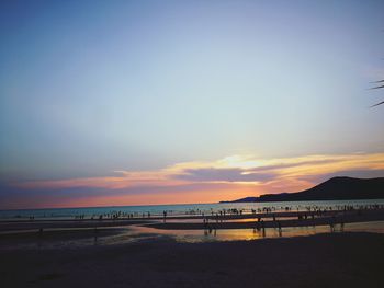 Scenic view of beach against sky during sunset