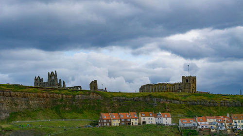 Low angle view of castle against cloudy sky
