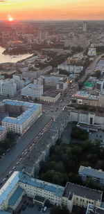 High angle view of illuminated street amidst buildings in city