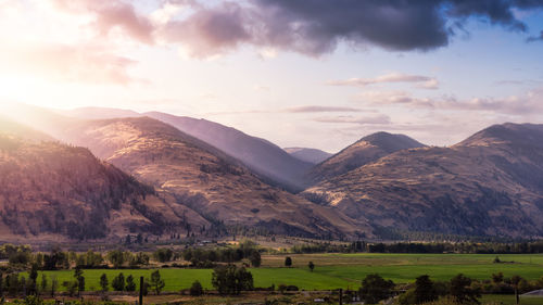 Scenic view of landscape and mountains against sky