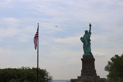 Low angle view of statue against sky