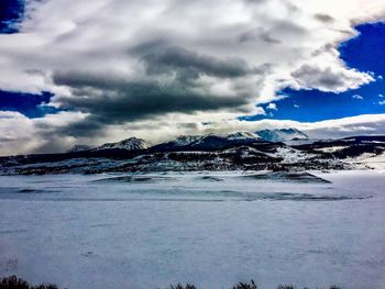 Scenic view of snowcapped mountains against sky