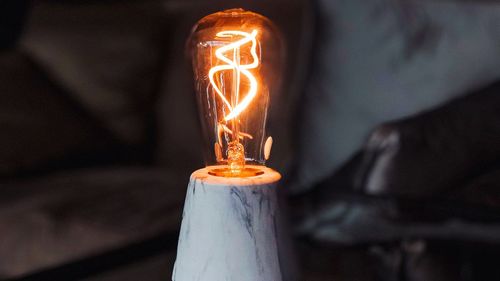 Close-up of illuminated light bulb