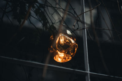 Low angle view of illuminated light bulb