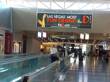 People on escalator in airport