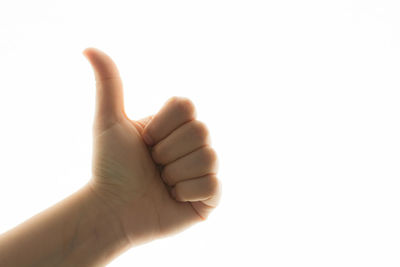 Close-up of human hand over white background