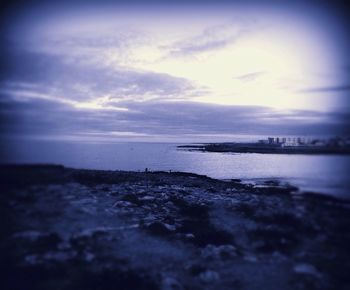 Scenic view of sea against cloudy sky