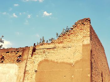 Low angle view of old building against sky