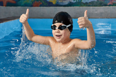 Portrait of woman swimming in pool