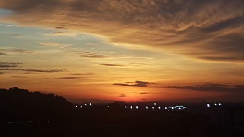 Scenic view of silhouette landscape against sky during sunset