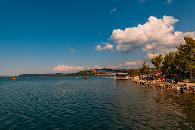 Scenic view of sea against blue sky