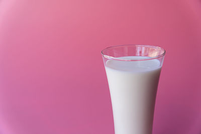 Close-up of drink against pink background