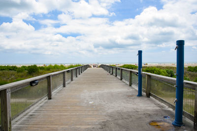Bridge over sea against sky
