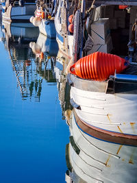 Boats moored at harbor