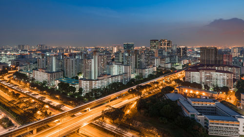 High angle view of illuminated buildings in city against sky