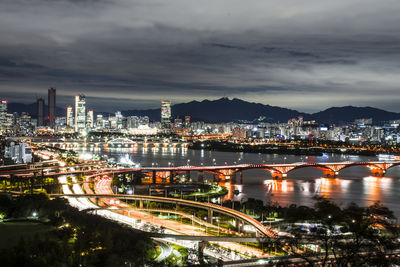 Illuminated buildings in city at night