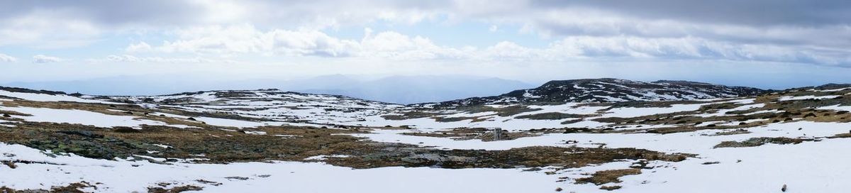 Scenic view of mountains against sky during winter