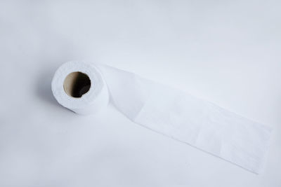 Close-up of toilet paper on white background