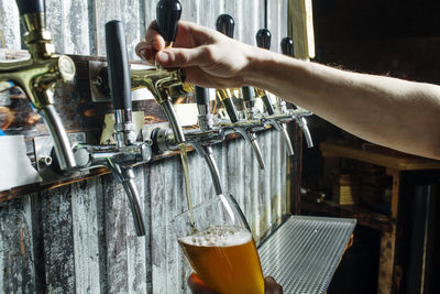 Close-up of hand holding drink