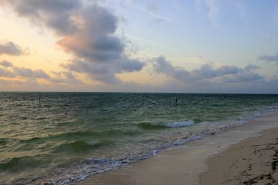 Scenic view of sea against sky at sunset