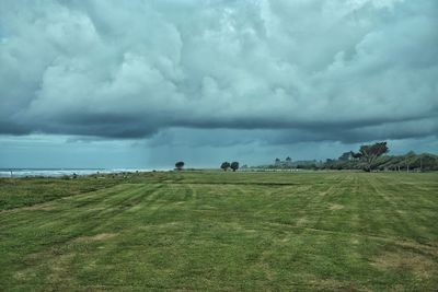 Scenic view of landscape against cloudy sky