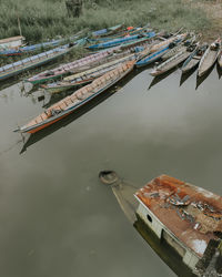 High angle view of fishing boats moored at harbor