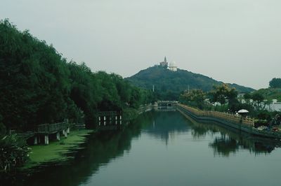 Bridge over river against sky