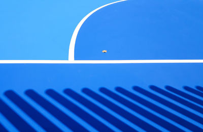 Close-up of metal against blue sky