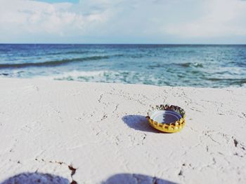 High angle view of plug on beach against sky