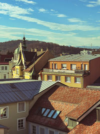 Houses in town against sky