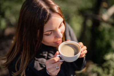 Young woman having coffee