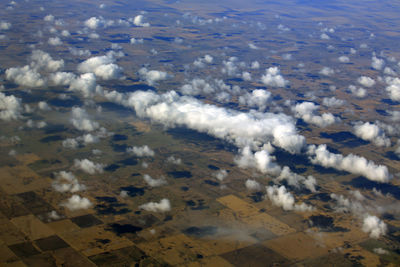 High angle view of airplane flying over land