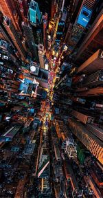 High angle view of illuminated buildings in city at night