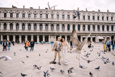 Group of people in front of historical building