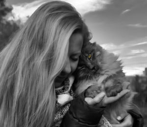 Close-up of woman holding cat