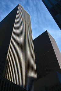 Low angle view of skyscrapers against sky